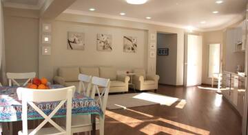Фото номера Апартаменты Делюкс Гостиница Alpha Apartments Voykova г. Сочи 13