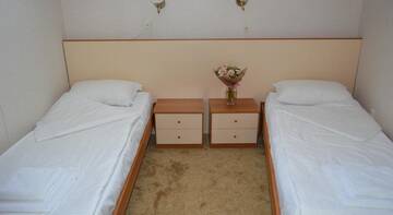 Фото номера Двухместный номер с 2 отдельными кроватями Гостиница Helius Hotel г. Сочи 6