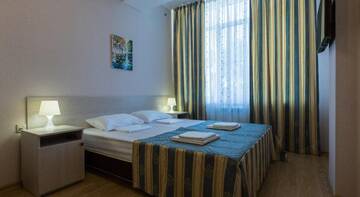 Фото номера Стандартный семейный номер с видом на море Гостиница Guest House Nika г. Сочи 11
