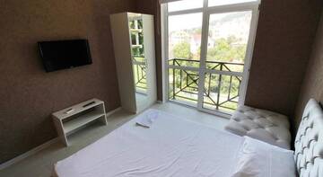 Фото номера Семейный двухместный номер с 1 кроватью Гостиница Guest house Nadegda г. Сочи 3