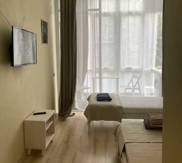 Фото номера Номер стандарт с 4 односпальными кроватями Апартаменты Golden Holiday Apartments г. Сочи 8