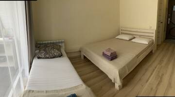 Фото номера Номер стандарт с 4 односпальными кроватями Апартаменты Golden Holiday Apartments г. Сочи 14