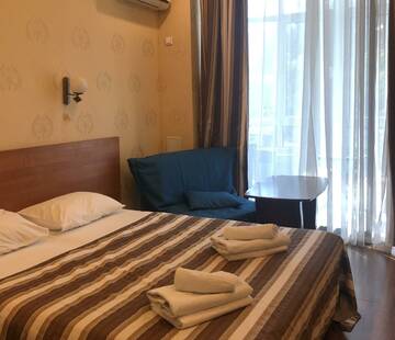 Фото номера Номер студия с 3 односпальными кроватями Апартаменты Golden Holiday Apartments г. Сочи 7