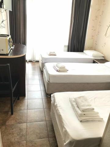 Фото номера Трехместный номер с видом на море Гостиница Joy Apartments г. Сочи 6