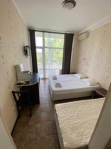 Фото номера Трехместный номер с видом на море Гостиница Joy Apartments г. Сочи 4
