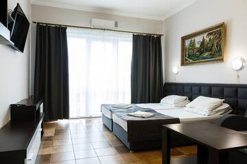 Фото номера Люкс 4 местный Гостиница Mini Hotel Parus г. Сочи 8