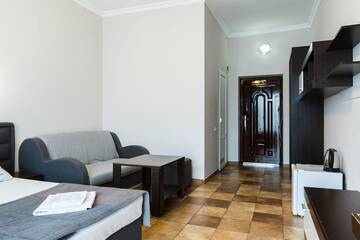 Фото номера Люкс 4 местный Гостиница Mini Hotel Parus г. Сочи 7